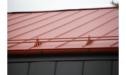 Фальц двойной стоячий Grand Line 0,45 Drap ST с пленкой на замках RAL 8004 терракота